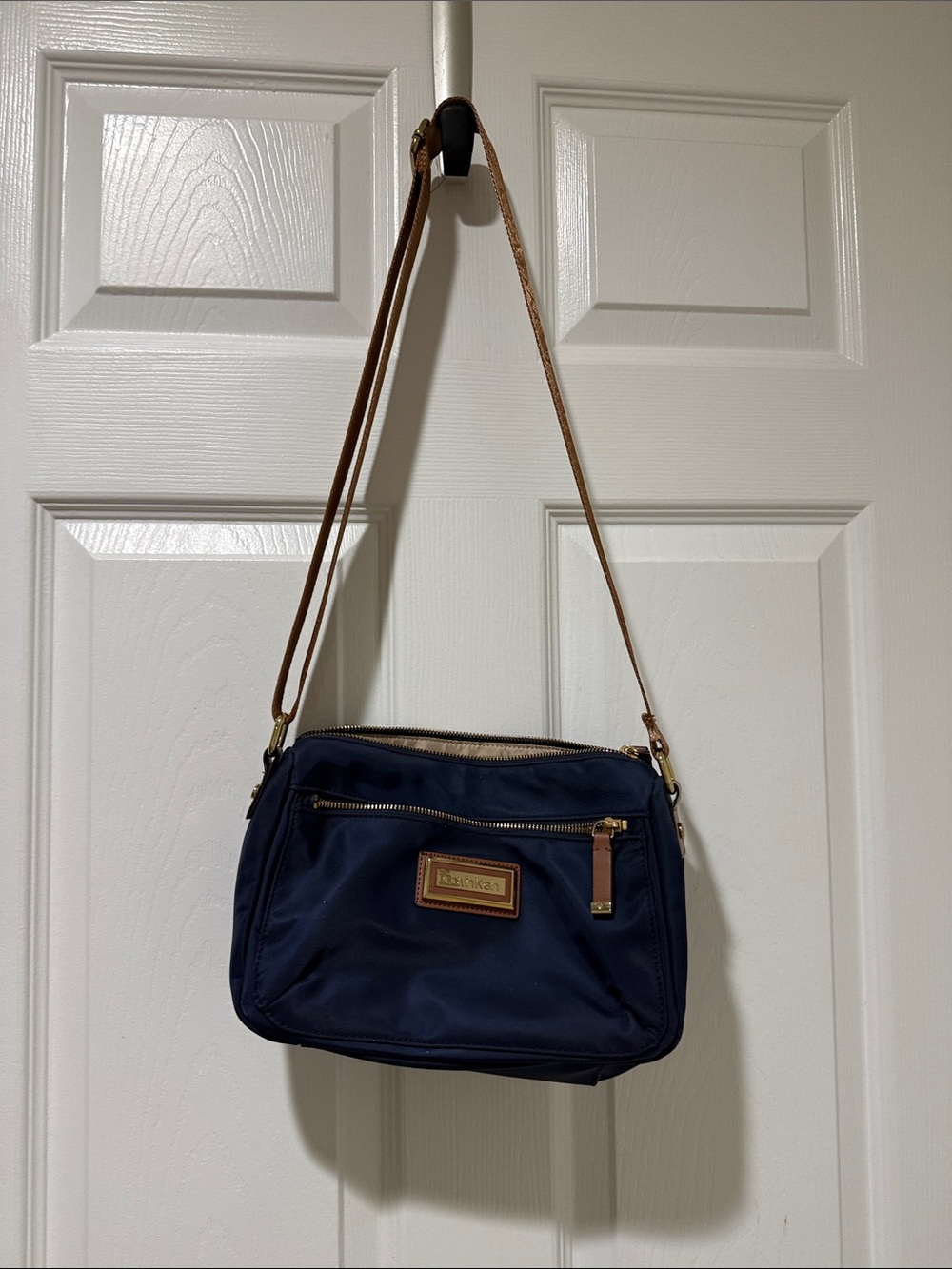 Calvin Klein Navy Crossbody with Tan water resistant Trim